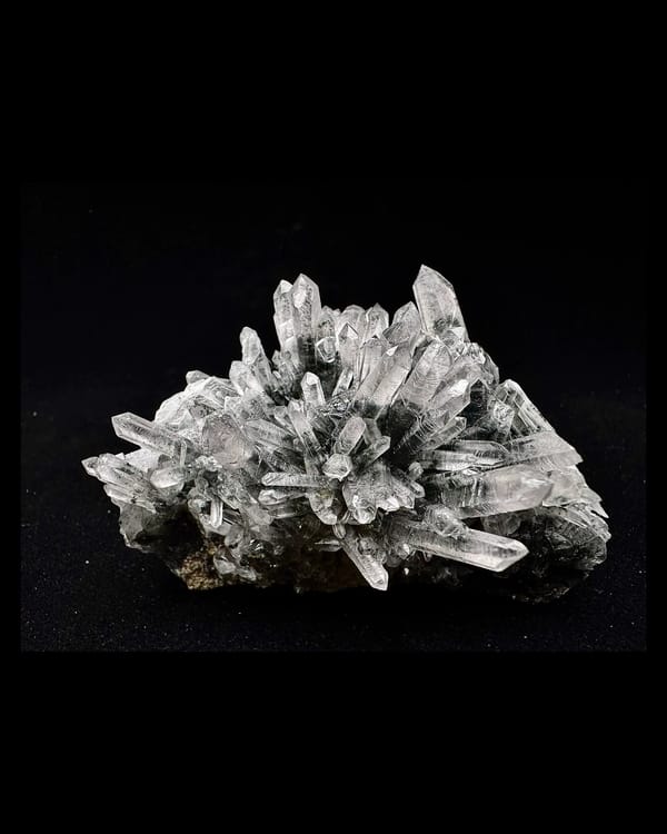 Complete front and low oblique view of quartz with dark green chlorite inclusions, Inner Mongolia