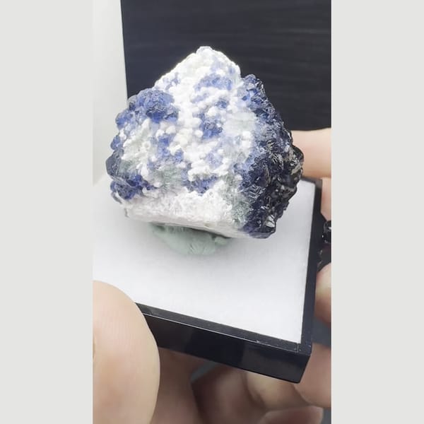 Deep blue blueberry fluorite with frosty white crystals from Inner Mongolia — complete view