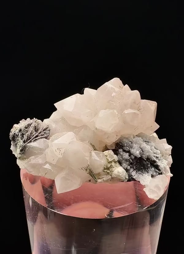 Complete front view of Pink Quartz with Natrolite and Specular Hematite