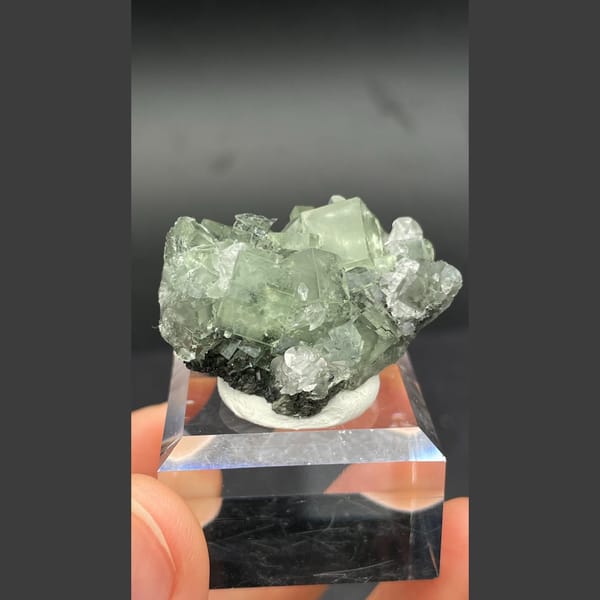 Soft green fluorite cubes with white calcite from Xianghualing, Hunan — complete view