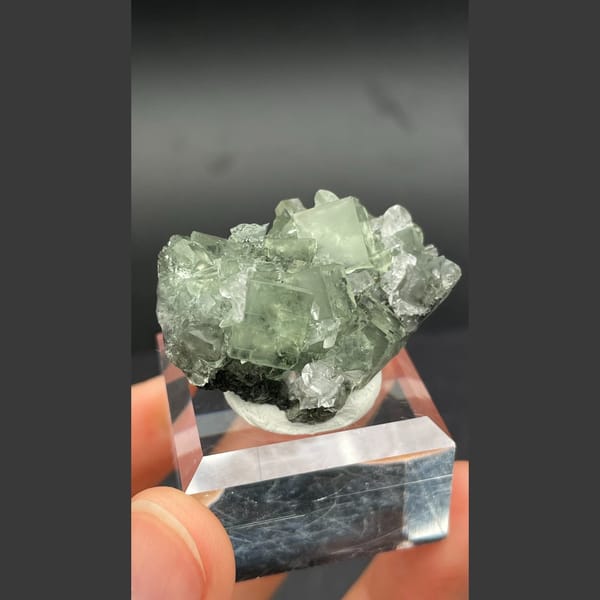 Soft green fluorite cubes with white calcite from Xianghualing, Hunan — alternate view