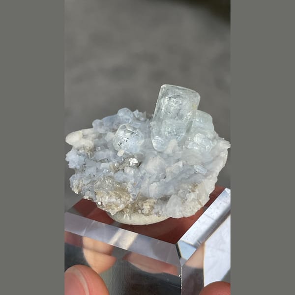 Columnar pale blue aquamarine on dolomite with mica from Xuebaoding, Sichuan — alternate view