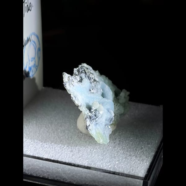 Sky blue ball creedite on black matrix — detail view