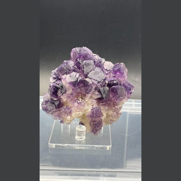 Large purple fluorite cluster with zoned cubes from Henan — complete view