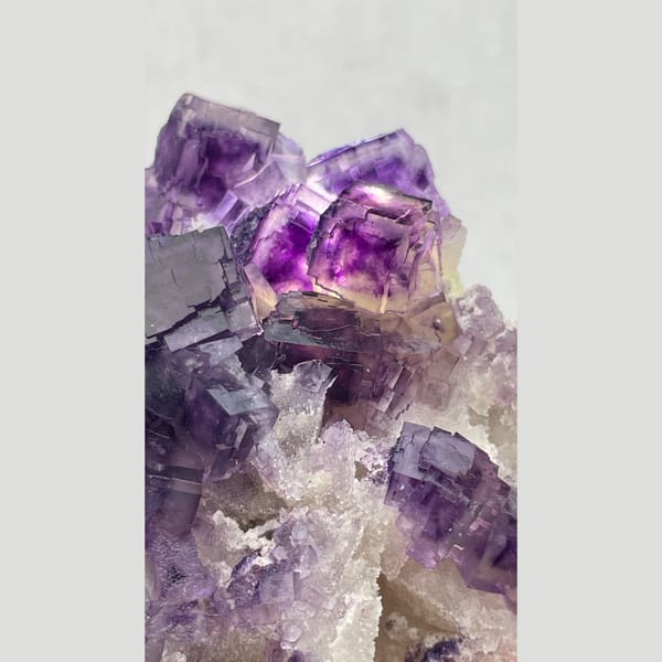 Large purple fluorite cluster with zoned cubes from Henan — detail view
