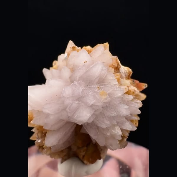 Small radiating white and honey-orange creedite ball from Guizhou — detail view