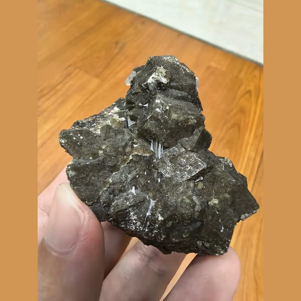 Brown garnet cluster with goethite and quartz — alternate view
