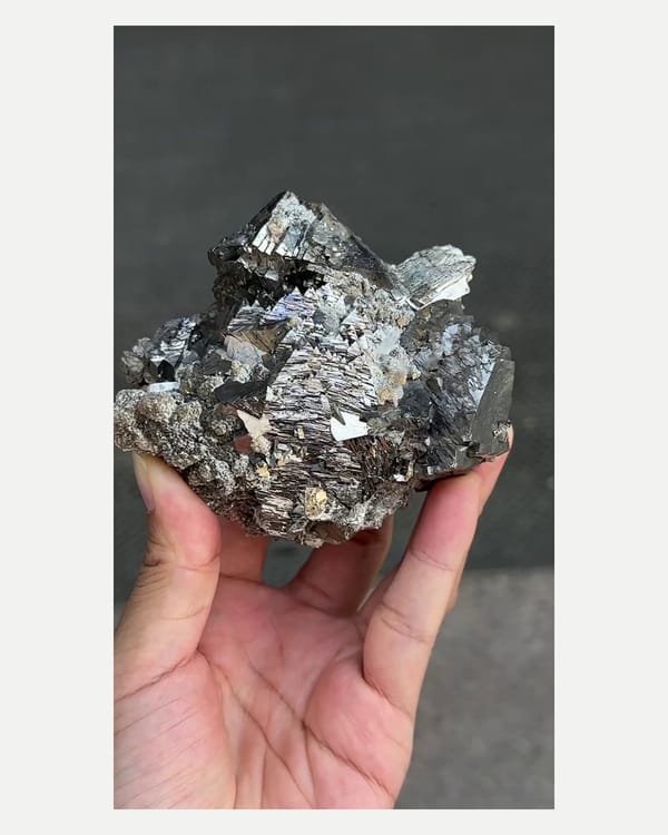 Complete front view of the exact arsenopyrite with mica and quartz specimen
