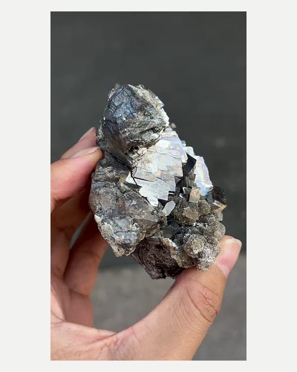 Complete side view of the exact arsenopyrite with mica and quartz specimen