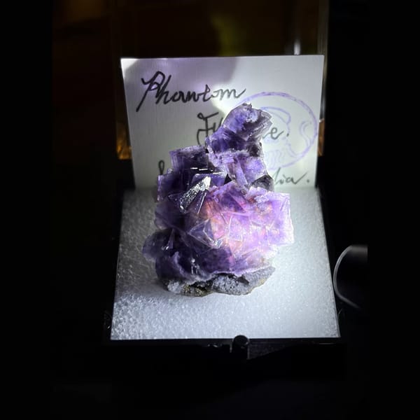 Violet phantom fluorite with pink core — complete view