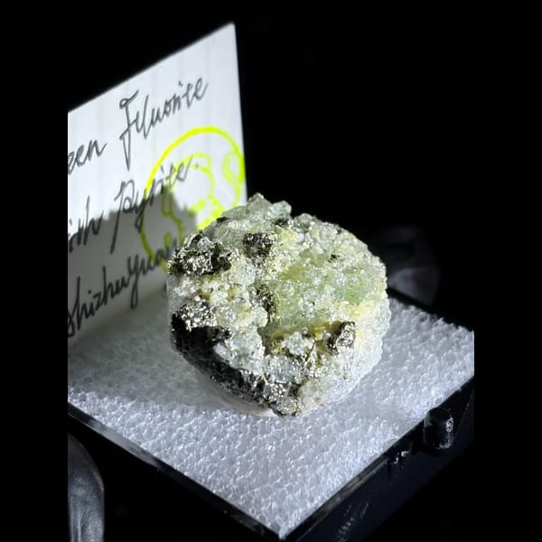 Mint-green fluorite with pyrite — detail view