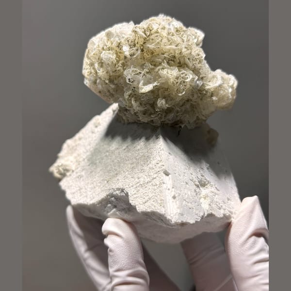 Pakistan mica ball with feldspar — detail view