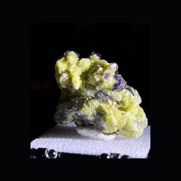 Clean whole rear-oblique view of zoned Okorusu fluorite with muscovite