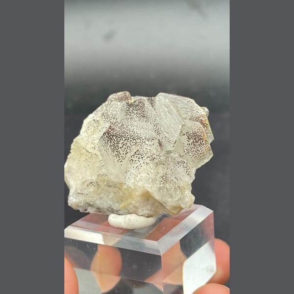 Fluorescent calcite with pyrite from Hunan — alternate view