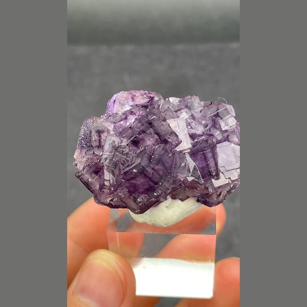 Purple fluorite cluster with geometric phantoms from Henan — alternate view