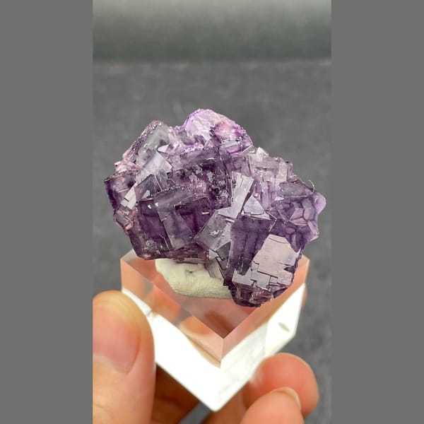 Purple fluorite cluster with geometric phantoms from Henan — detail view