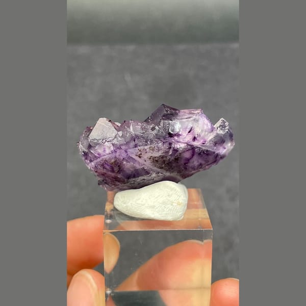 Purple fluorite cluster with geometric phantoms from Henan — detail view