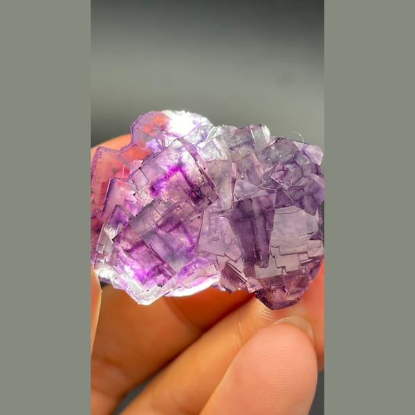 Purple fluorite cluster with geometric phantoms from Henan — detail view