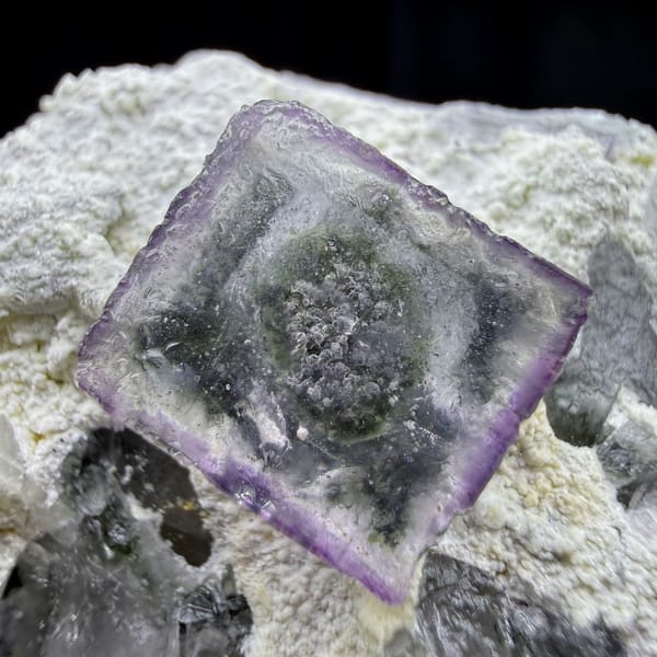 Purple-edged crystal in crystal fluorite cube from Yaogangxian, Hunan — alternate view