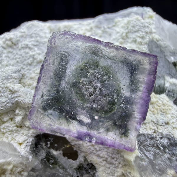 Purple-edged crystal in crystal fluorite cube from Yaogangxian, Hunan — detail view