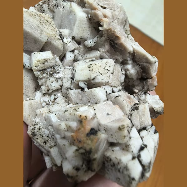 Feldspar cluster with epidote — alternate view