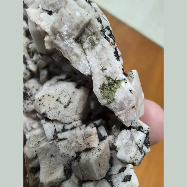 Feldspar cluster with epidote — alternate view
