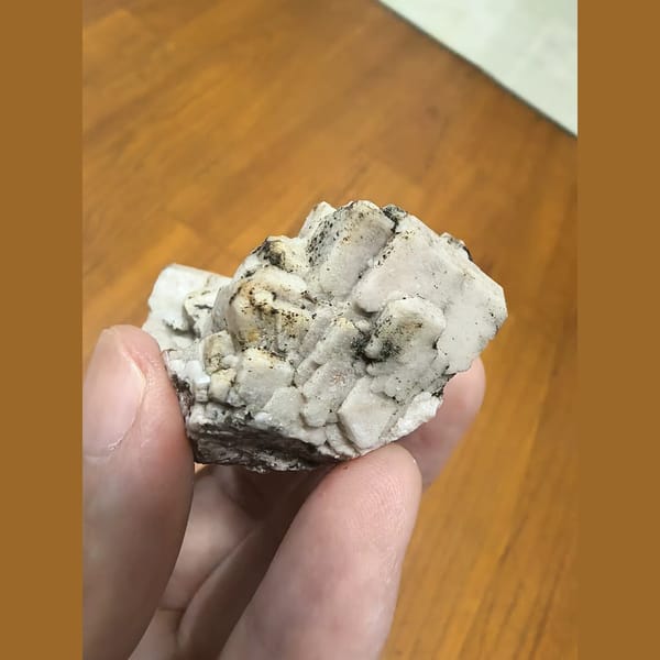 Feldspar cluster with epidote — detail view