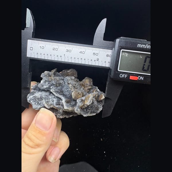 Grey sugary calcite with pseudomorph crystals from Longyan, Fujian — alternate view