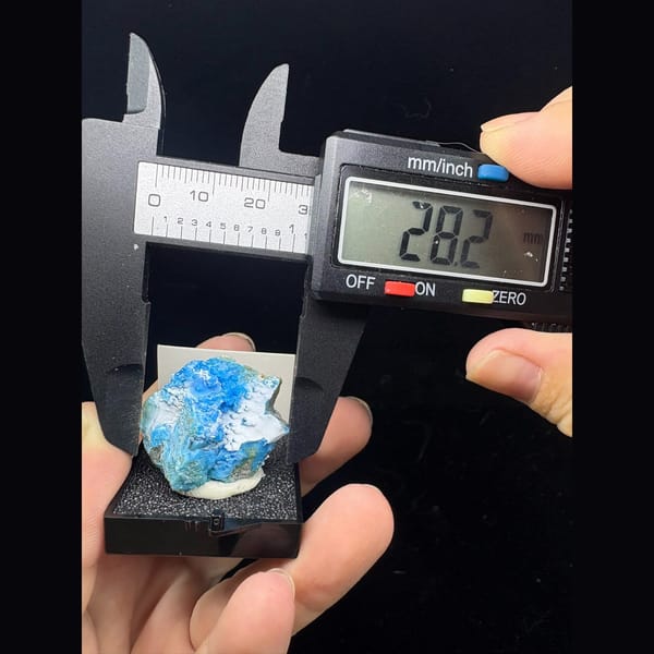 Small vivid blue allophane with frosty white gibbsite from Qinglong — alternate view