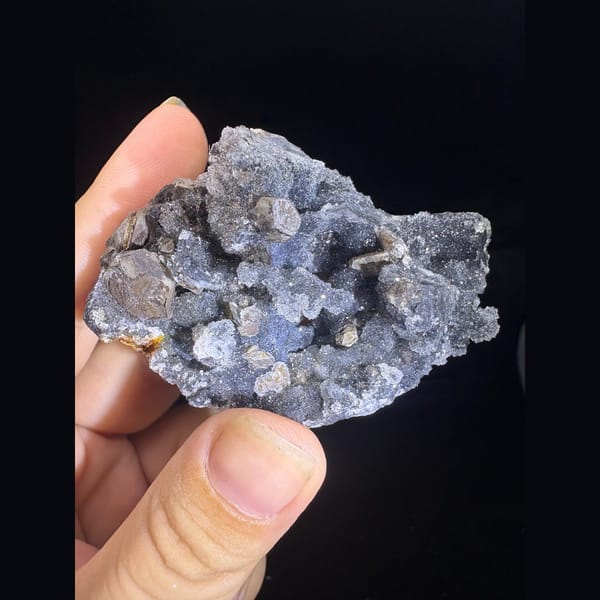 Grey-blue sugary calcite with pseudomorph crystals from Longyan — complete view