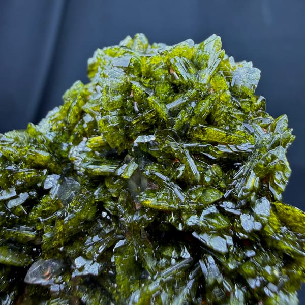 Sparkling green epidote crystal cluster from Sichuan — complete view