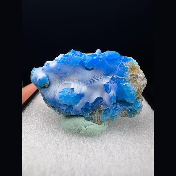 Rounded glossy blue allophane from Qinglong, Guizhou — alternate view