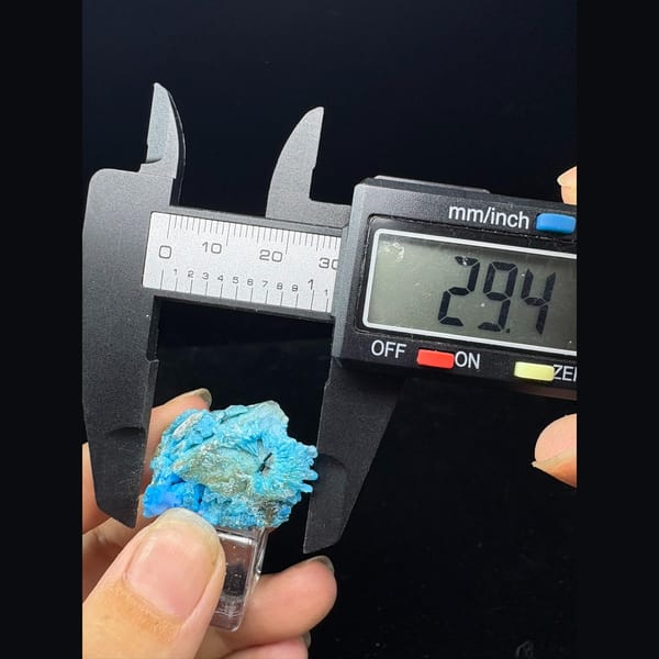 Small frothy bright blue allophane from Qinglong, Guizhou — alternate view