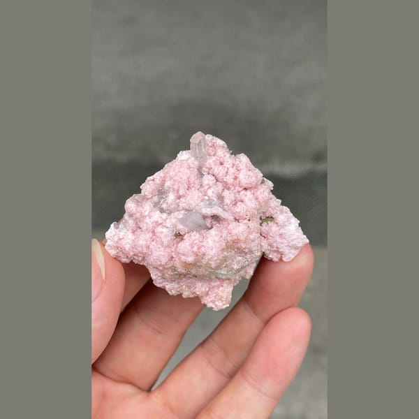Frosty pale pink rhodochrosite with quartz from Bulgaria — detail view