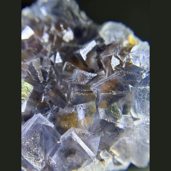 Icy blue fluorite with limonite from Yunnan — detail view