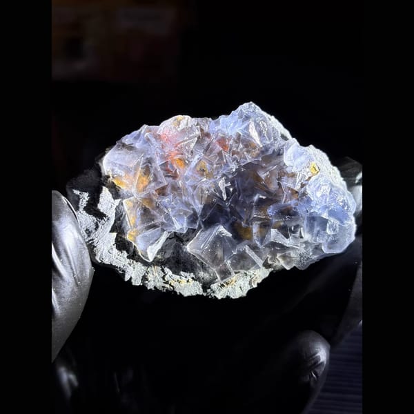 Icy blue fluorite with limonite from Yunnan — detail view
