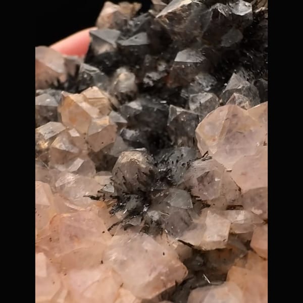 Pale pink quartz with dark goethite-coated quartz from Morocco — detail view