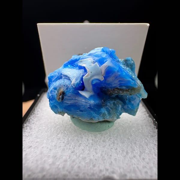Small vivid blue allophane with white swirls from Qinglong — complete view