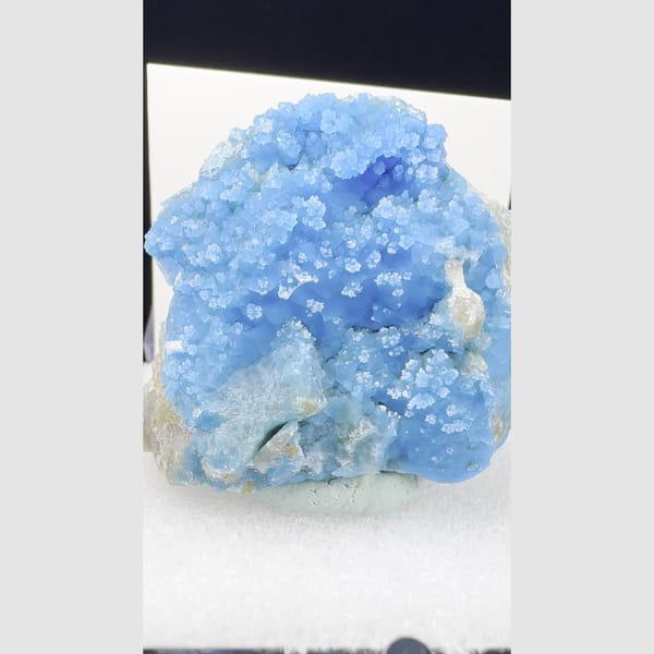 Vivid blue allophane dome with snowy white gibbsite from Qinglong — alternate view
