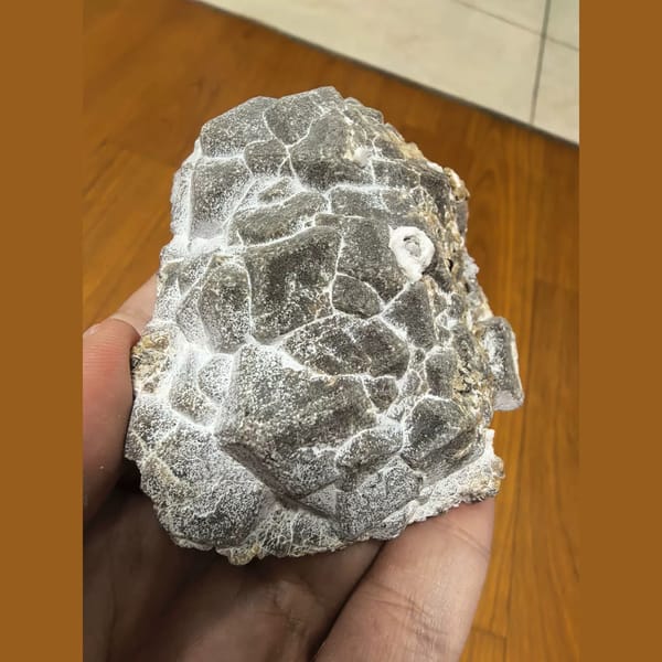 Unusual pale garnet cluster — complete view