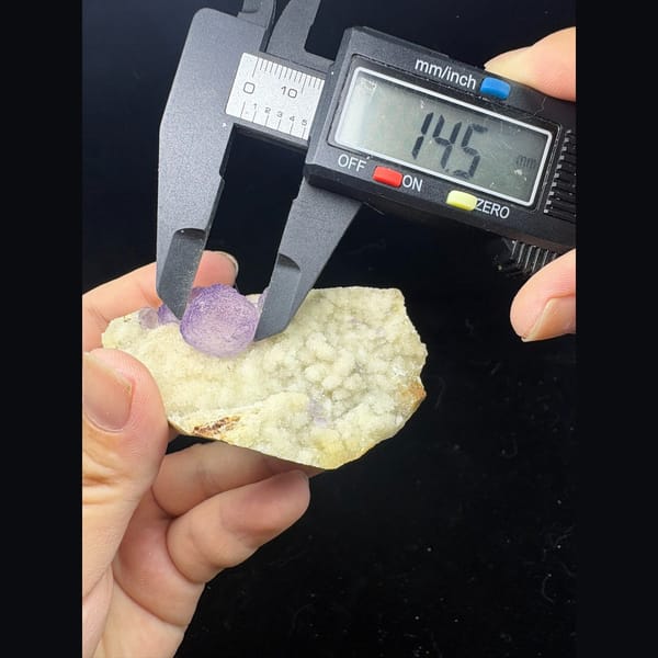 Lavender purple fluorite on white sugary quartz from Qinglong — detail view