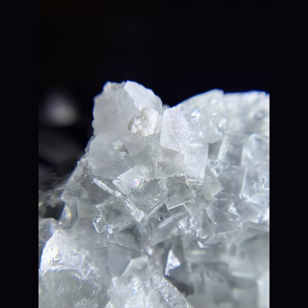 Clear cubic fluorite cluster from Xianghualing — detail view
