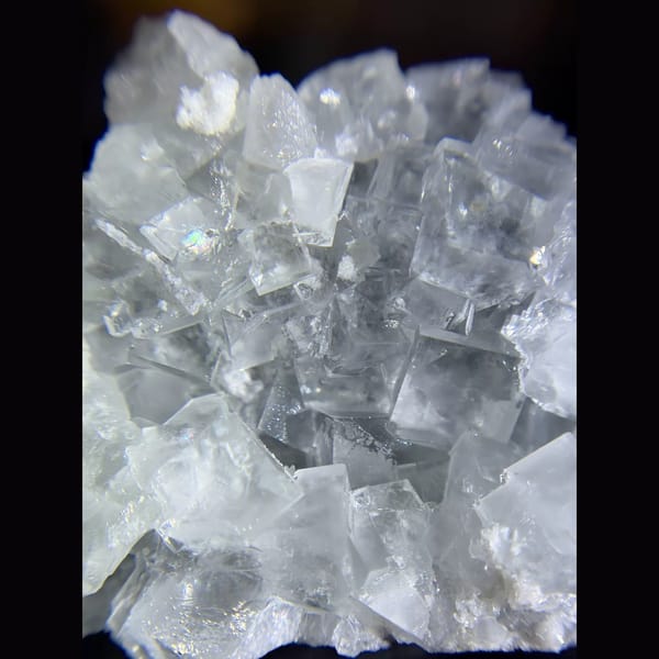 Clear cubic fluorite cluster from Xianghualing — detail view