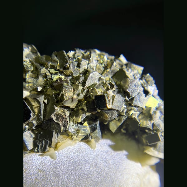 Pyrite on zoned tabular barite from Morocco — detail view