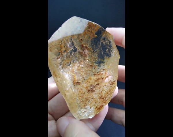 Complete front view of the exact polished included quartz window specimen