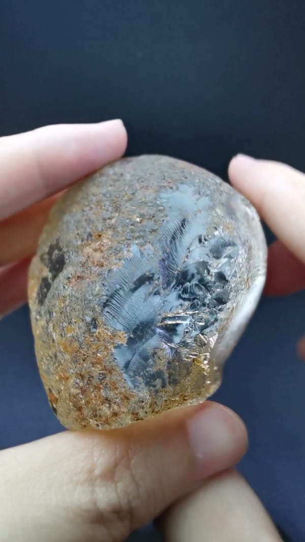 Complete side view of the polished quartz window and natural outer form