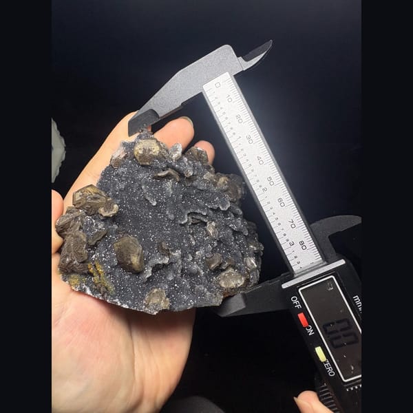 Grey sugary calcite pseudomorph cluster from Longyan — detail view