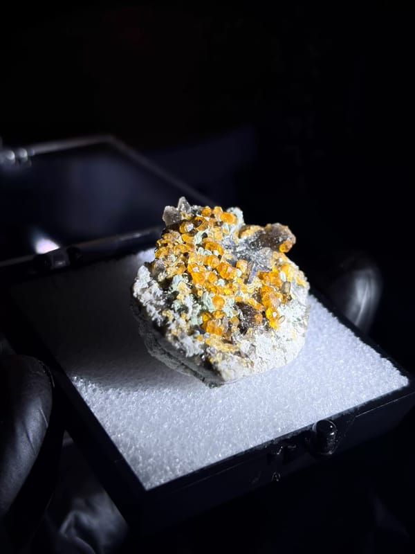Complete left oblique view of the exact spessartine garnet specimen