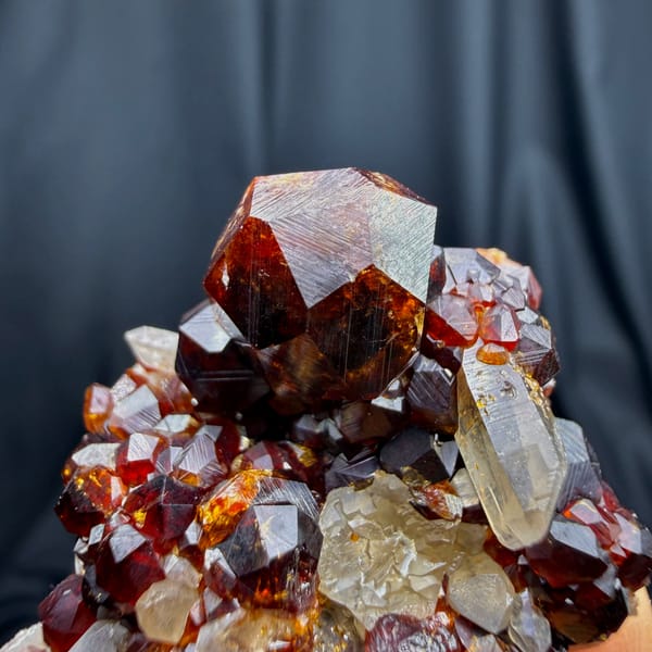 Glossy red-brown spessartine garnet crystals with smoky quartz from Yunxiao, Fujian — complete view