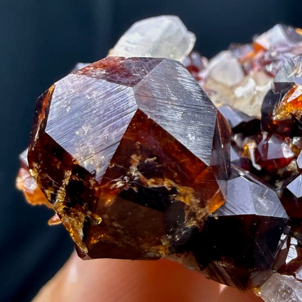 Glossy red-brown spessartine garnet crystals with smoky quartz from Yunxiao, Fujian — alternate view